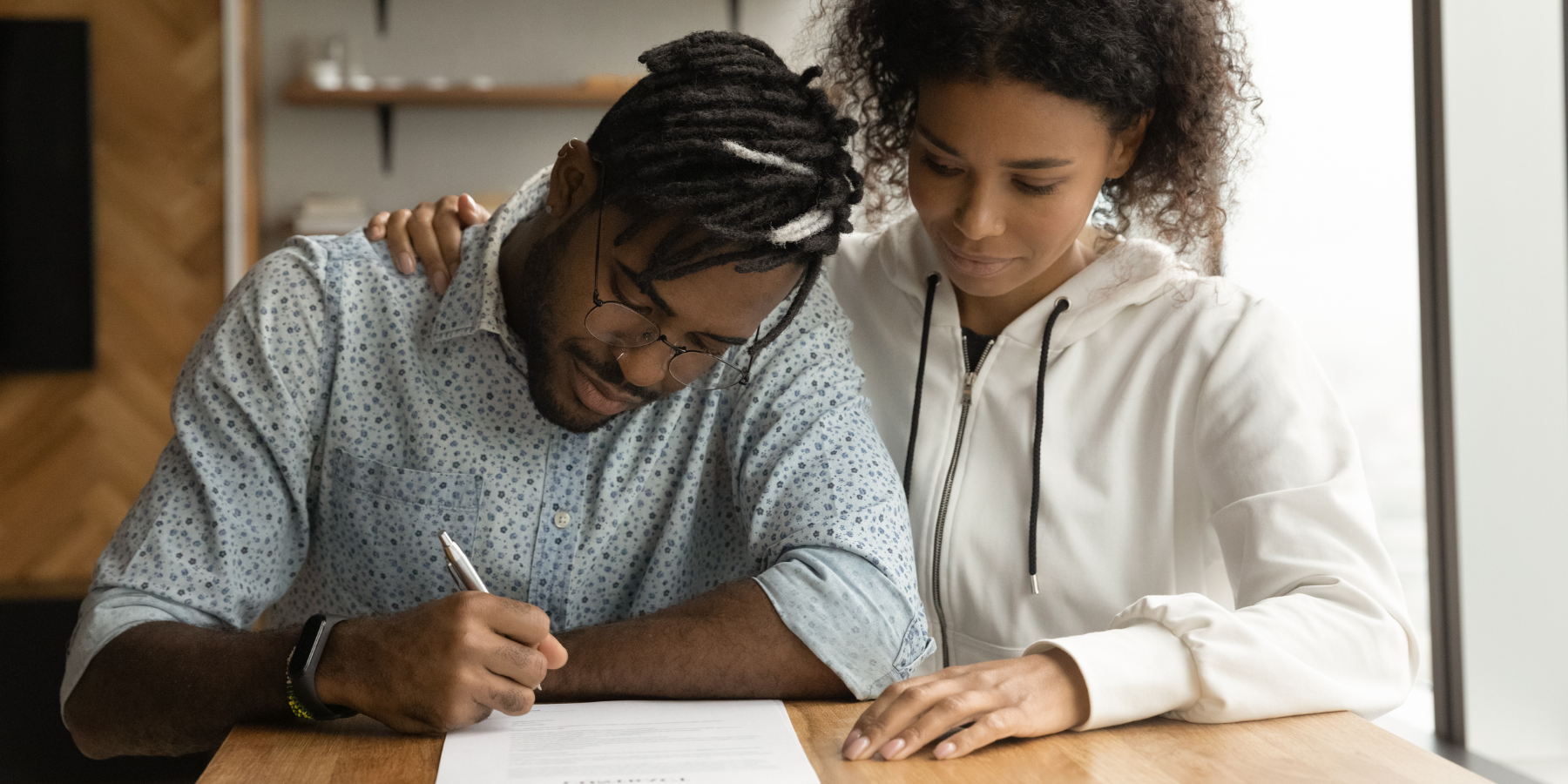 man and woman signing a Will and Probate