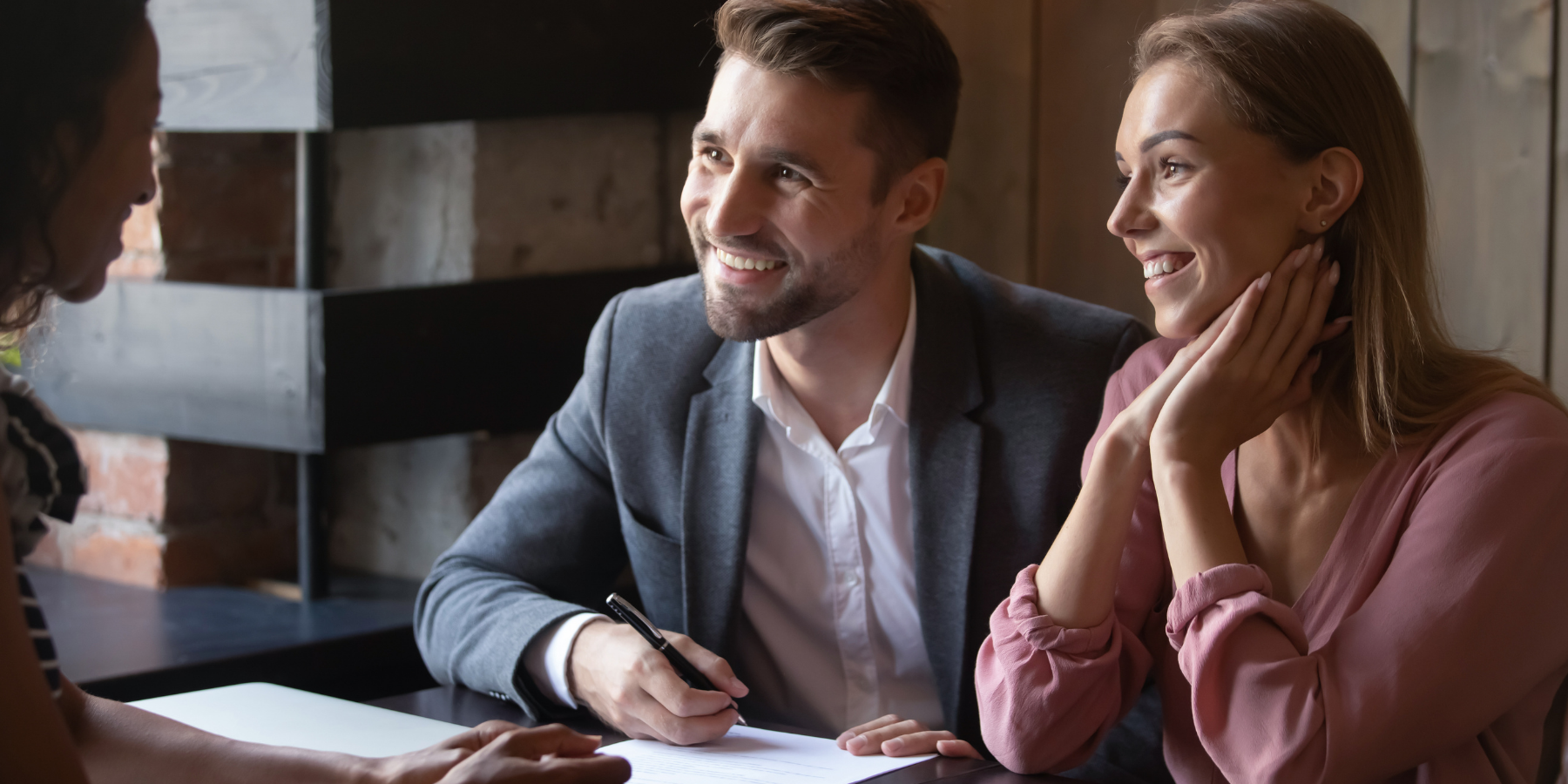 man and woman talking with an attorney