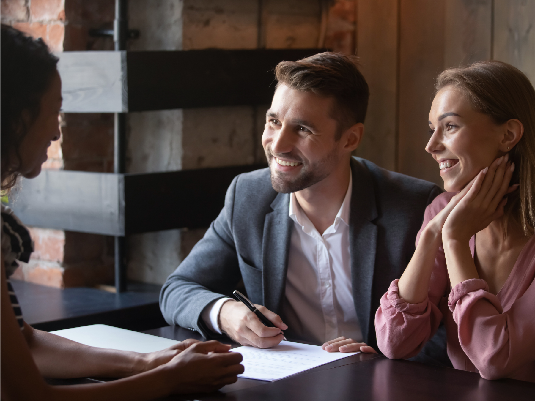 man and woman talking with an attorney